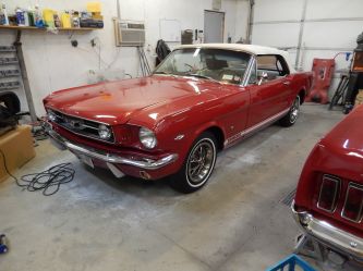 Paint and interior were restored. This is the second red '66 convertible one we have done. 