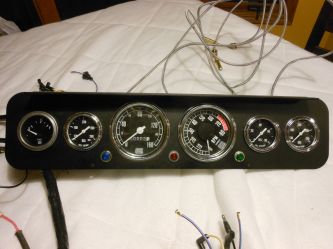Stuart Warner gages are installed which are duplicates of original R model dash gages.