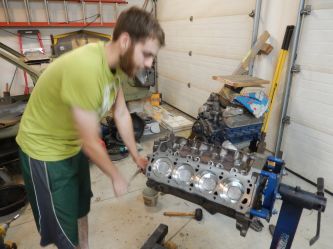 After machine shop work Sean assembles the engine.