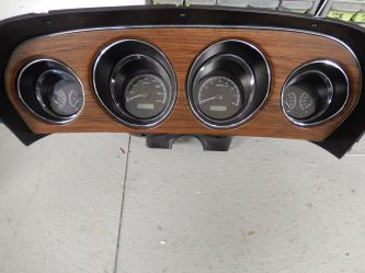 We can install modern instruments in a vintage dashboard. This can give a built in tach and all the gages. 